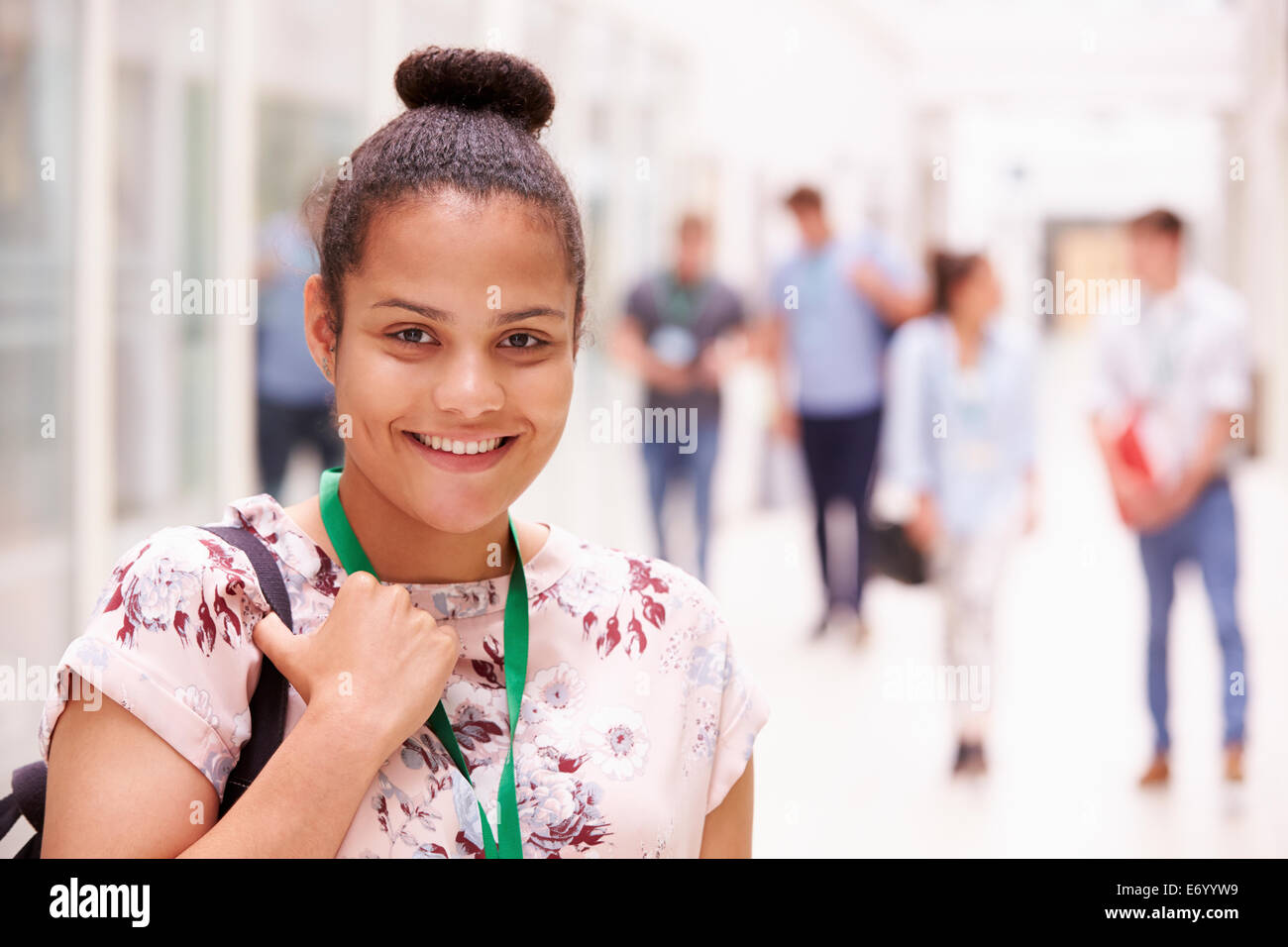 Portrait Of Female College Student In Hallway Stock Photo