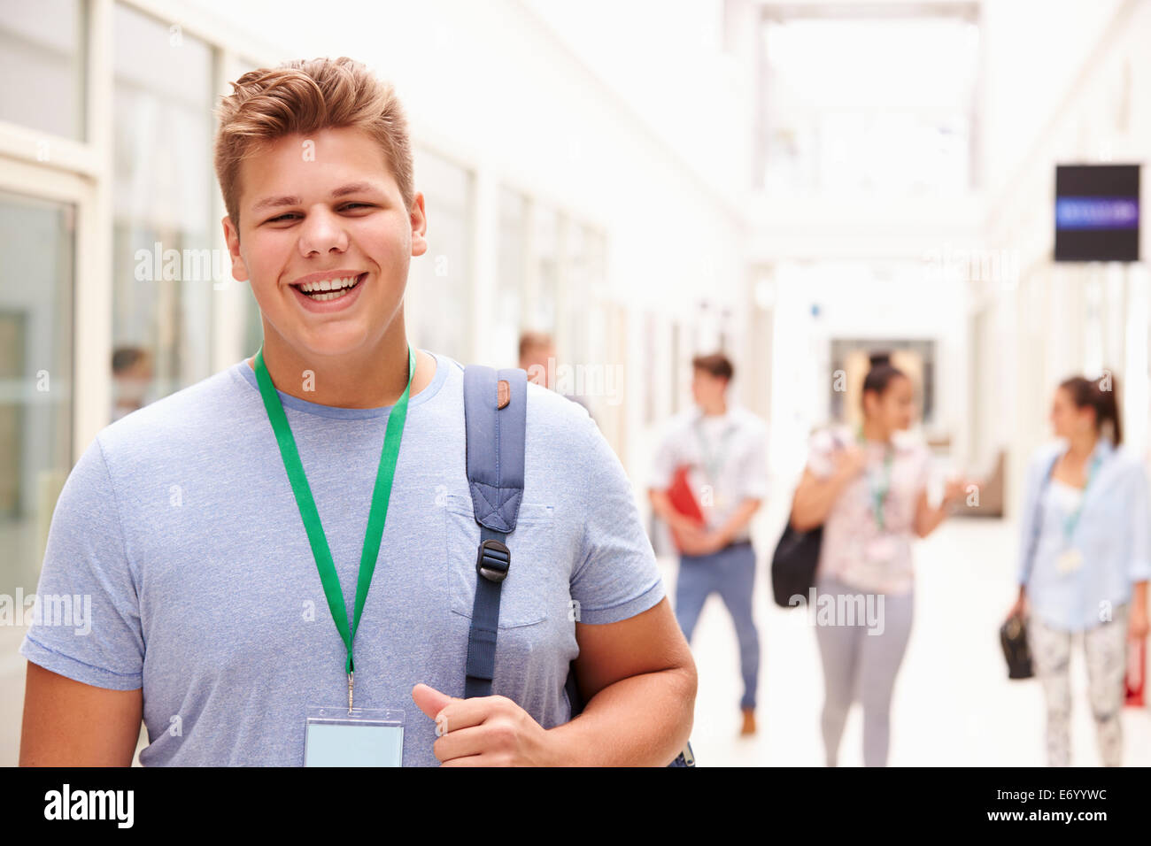 Portrait Of Male College Student In Hallway Stock Photo