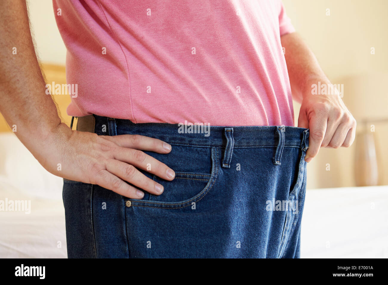 Close Up Of Man On Diet Losing Weight From Waist Stock Photo