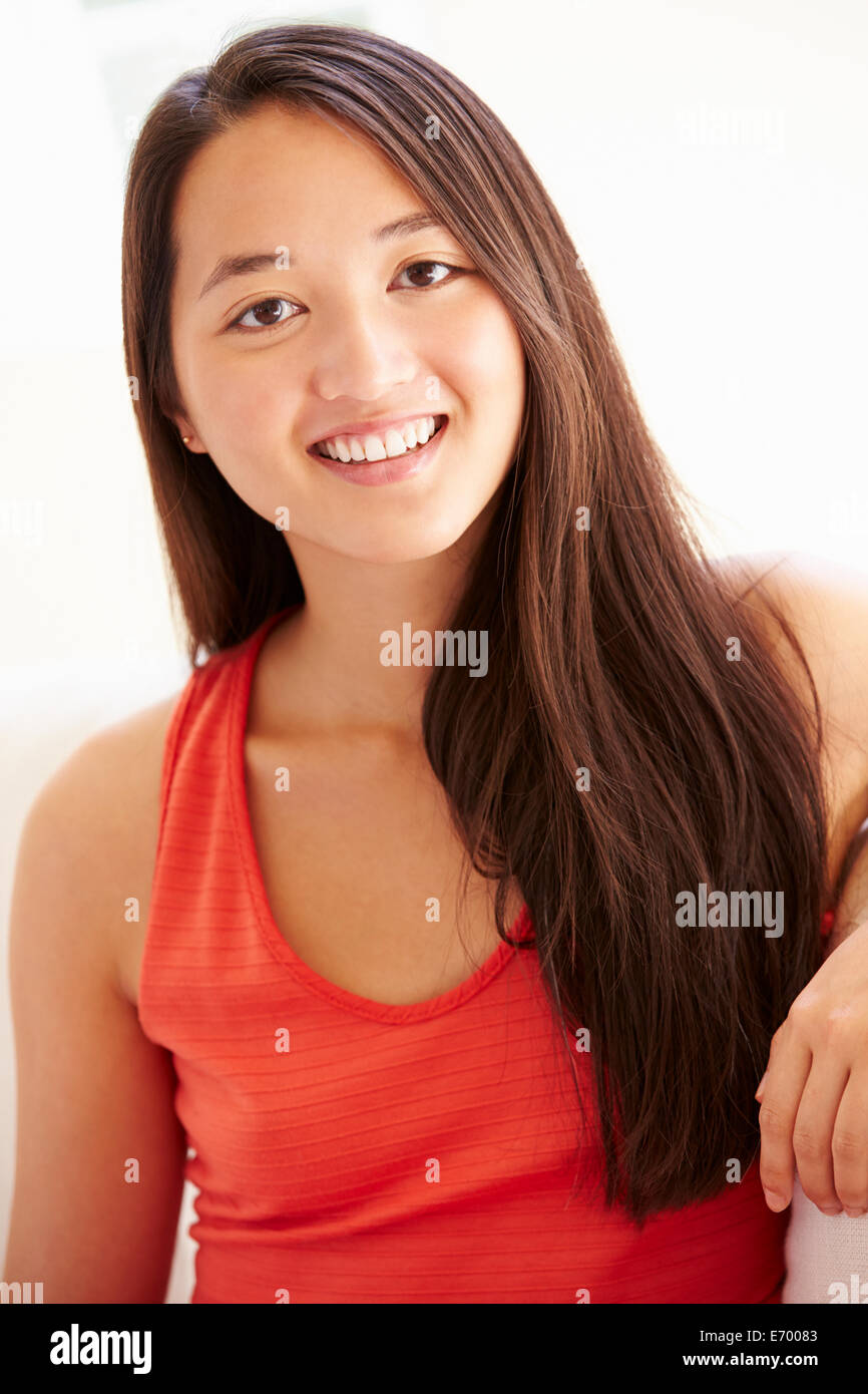 Portrait Of Asian Woman Relaxing Sitting On Sofa Stock Photo