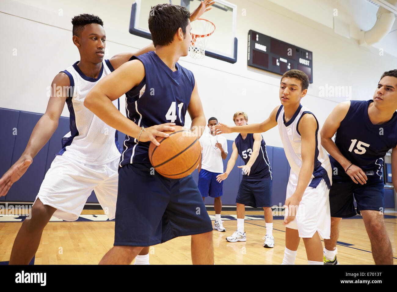 Male High School Basketball Team Playing Game Stock Photo