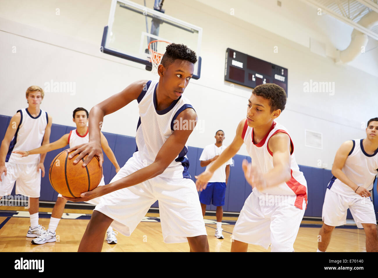 Male High School Basketball Team Playing Game Stock Photo
