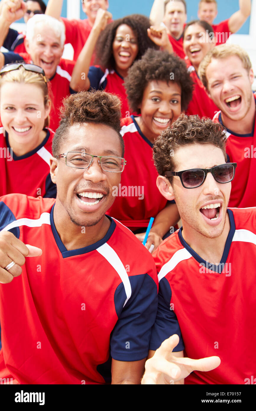 Spectators In Team Colors Watching Sports Event Stock Photo