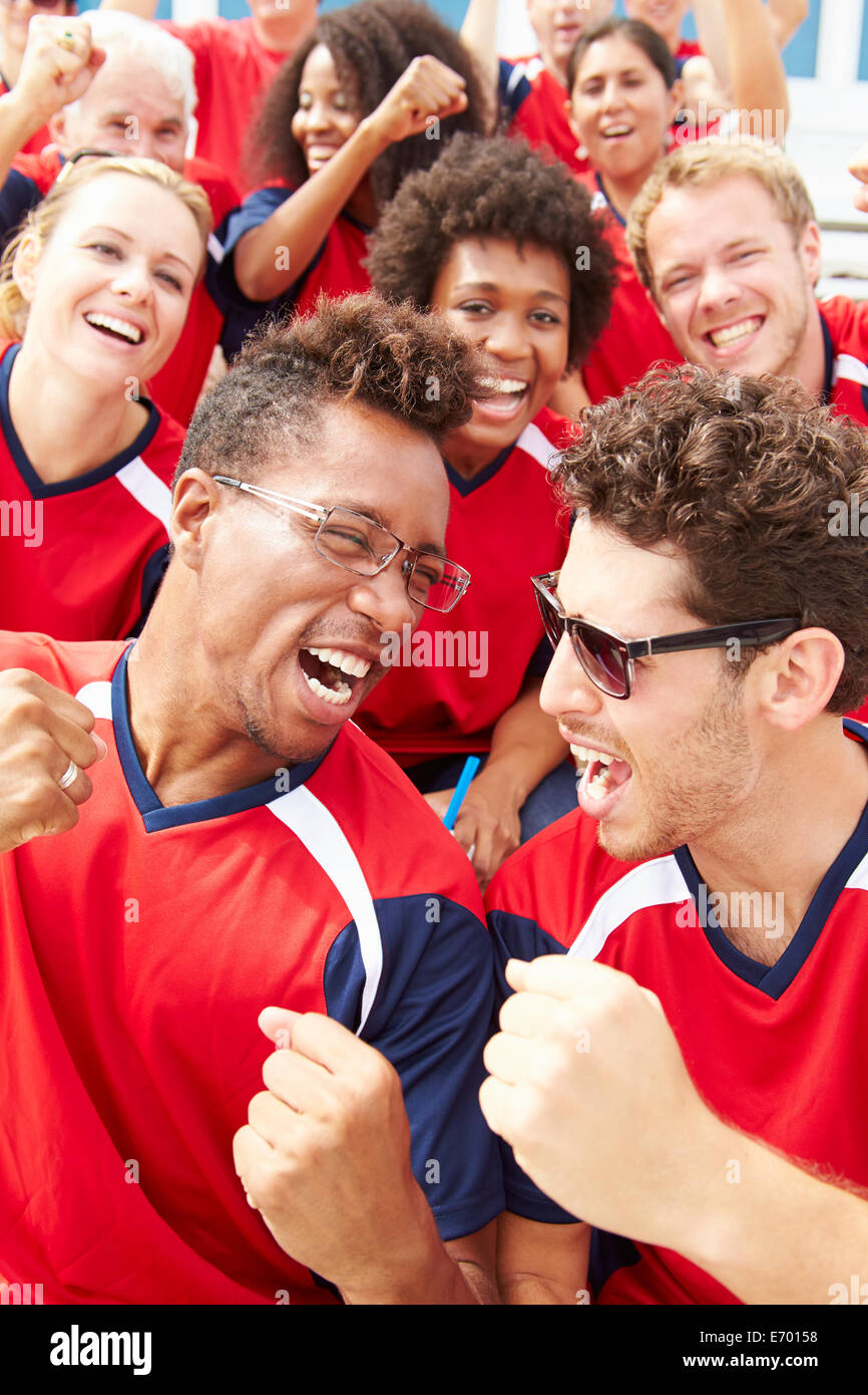 Spectators In Team Colors Watching Sports Event Stock Photo
