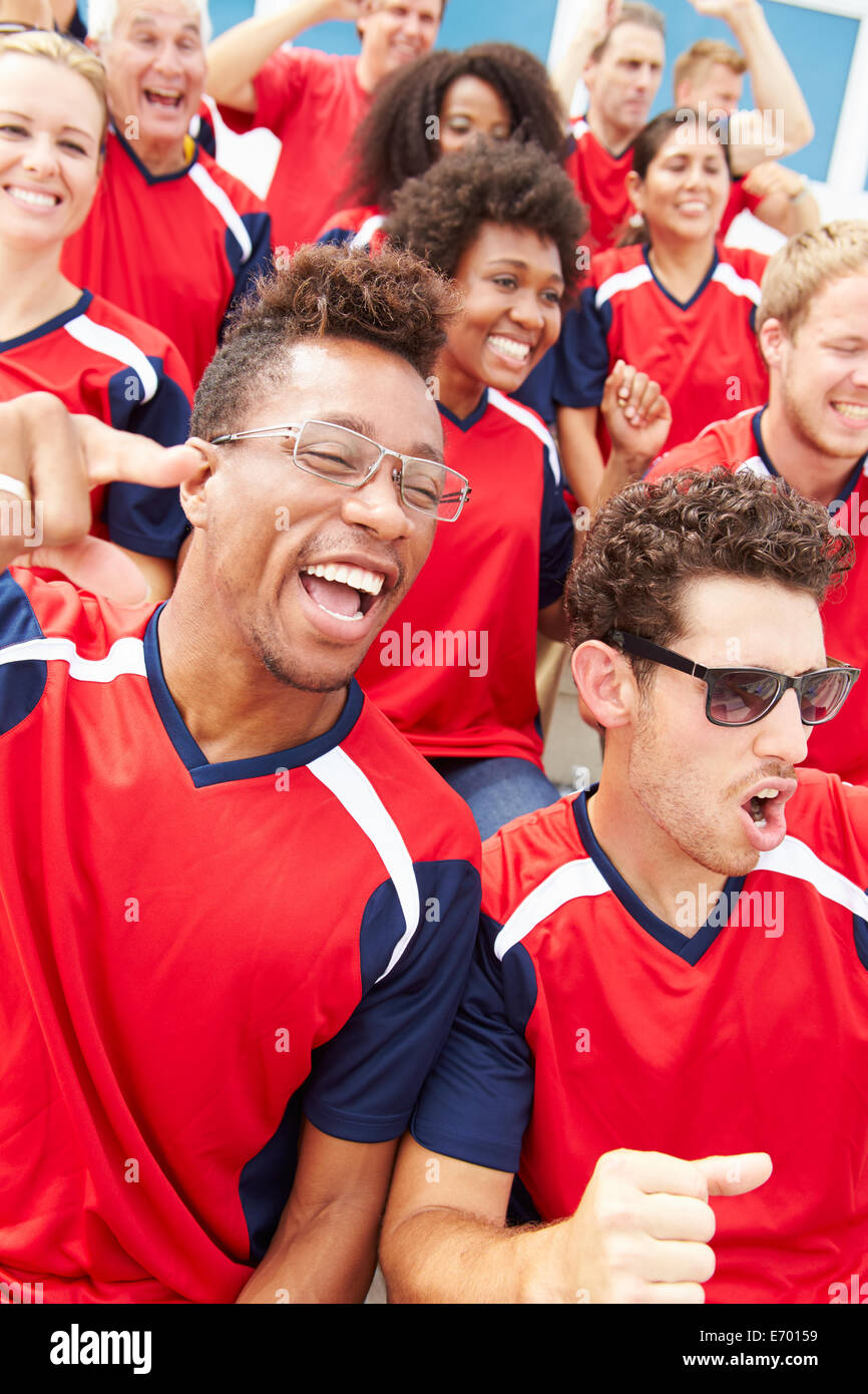 Spectators In Team Colors Watching Sports Event Stock Photo