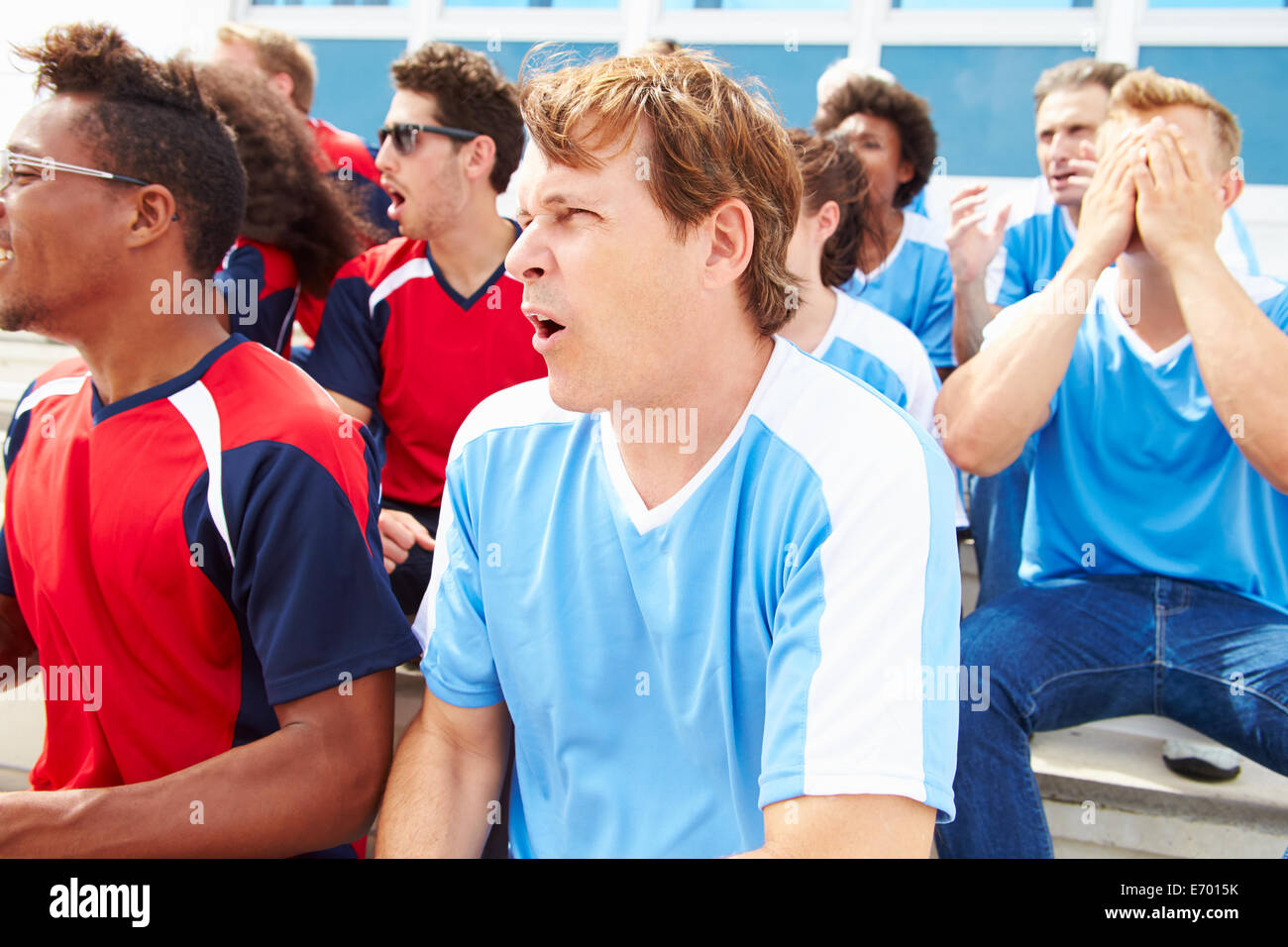 Rival Spectators Watching Sports Event Stock Photo