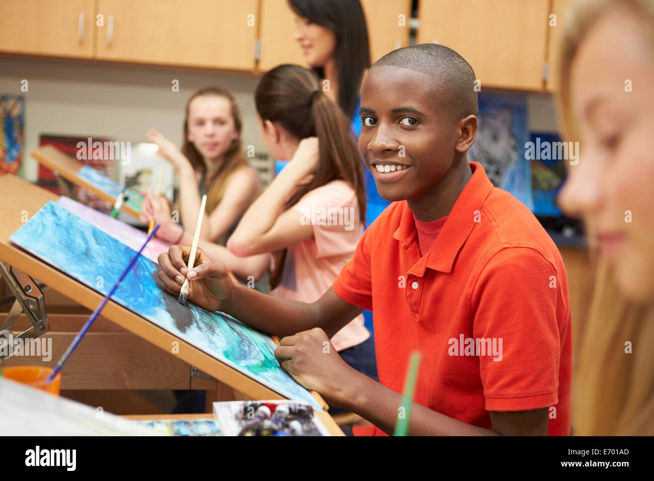Male Pupil In High School Art Class Stock Photo
