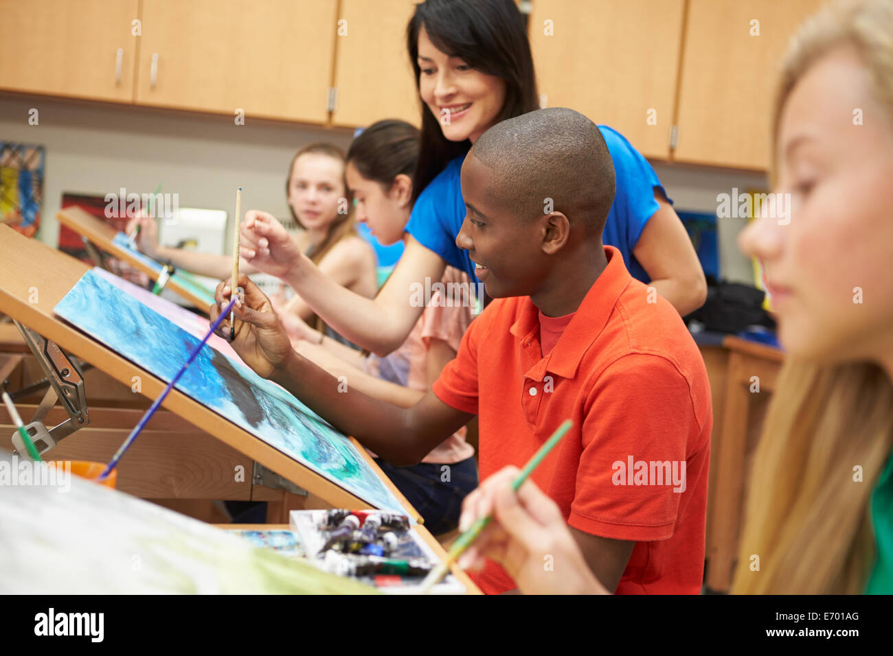 Male Pupil In High School Art Class With Teacher Stock Photo - Alamy