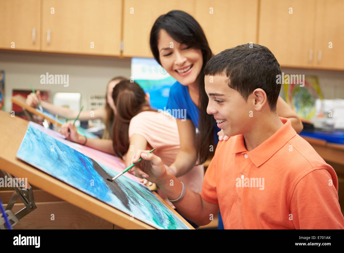 Male Pupil In High School Art Class With Teacher Stock Photo - Alamy