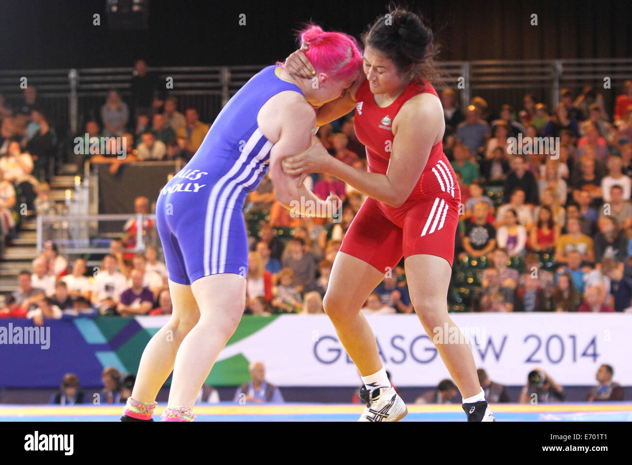 Stevie Kelly of Australia (red) v Sarah Connolly of Wales (blue) in the womens 63kg freestyle wrestling quarter finals. Stock Photo