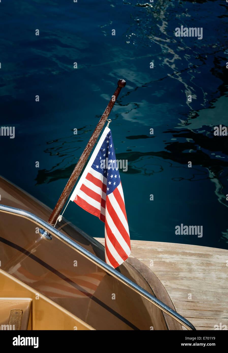 American flag on a boat in harbor. Stock Photo