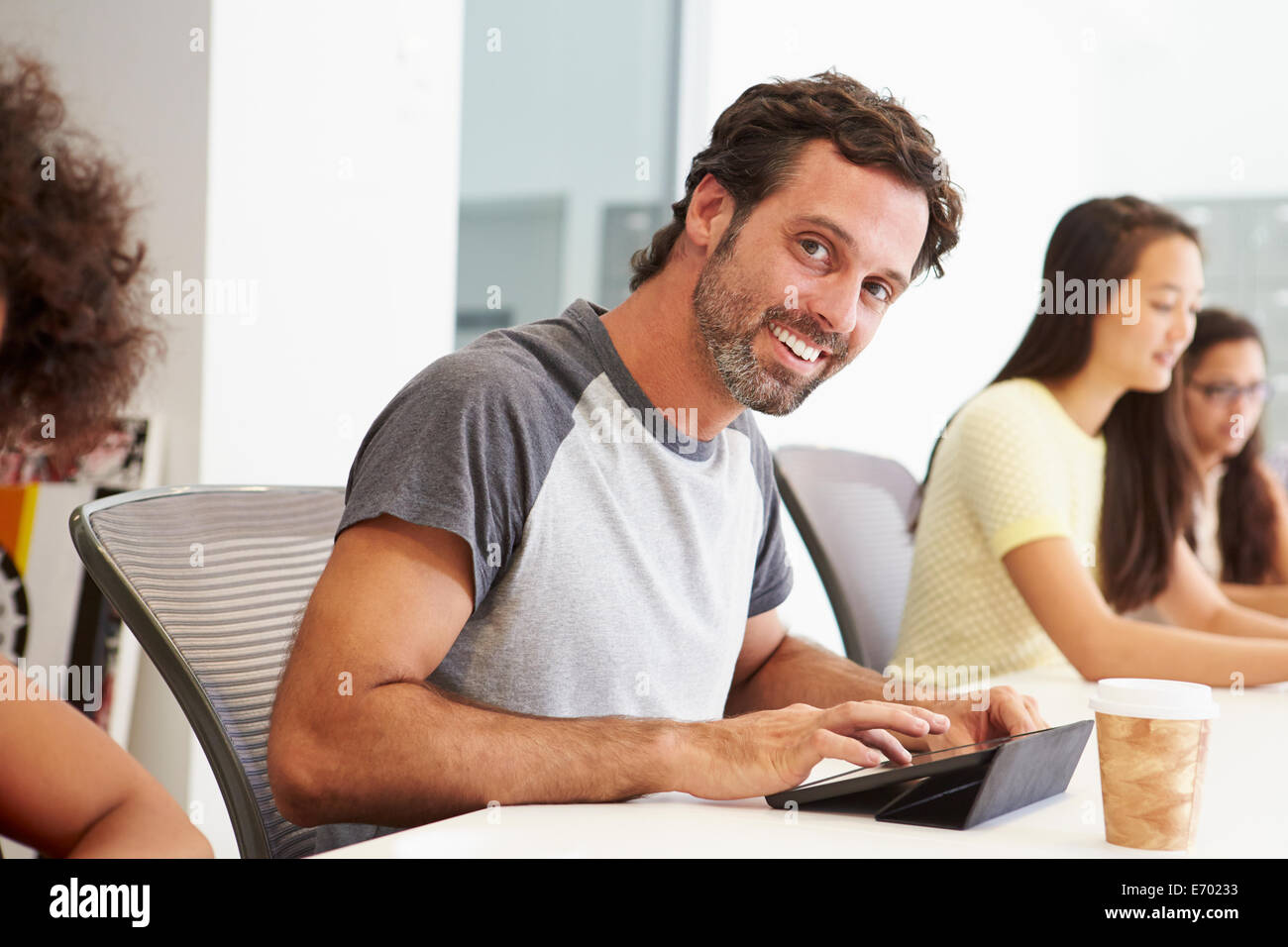 Design Team Collaborating On Project Together Stock Photo