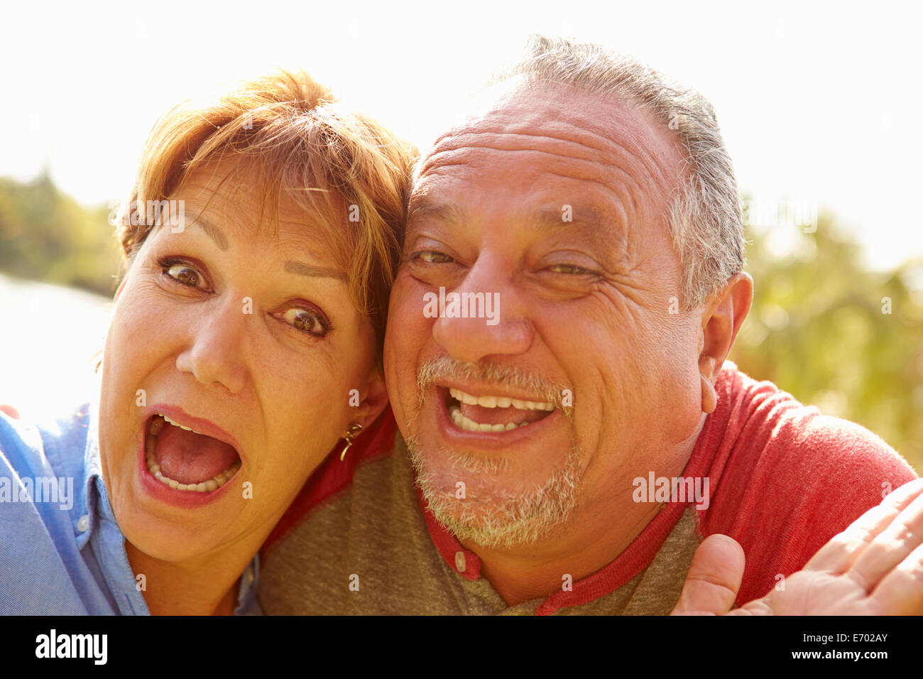 Head and Shoulders Portrait Of Senior Couple In Garden Stock Photo