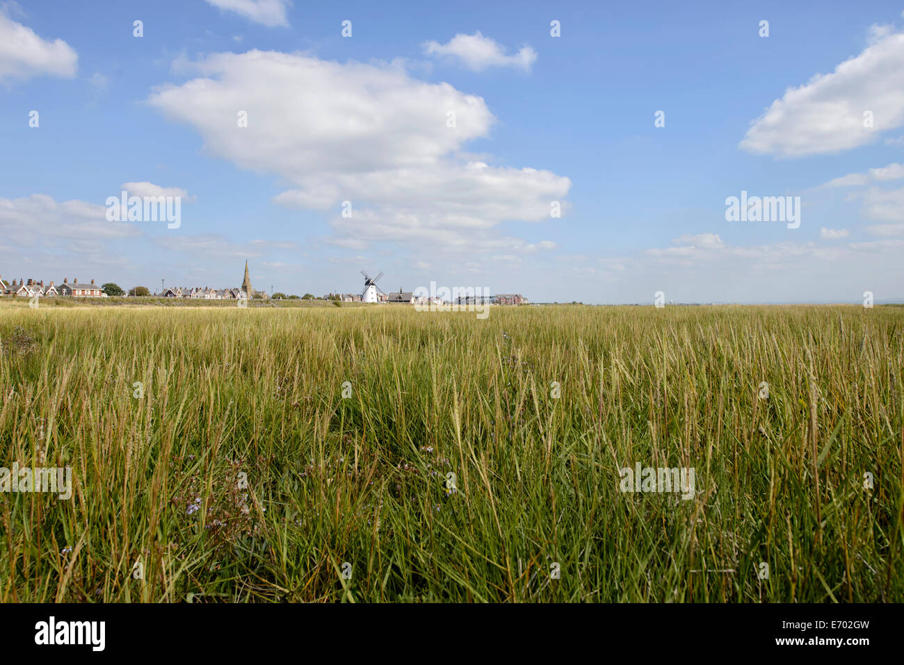 View from the marsh back towards the town of Lytham in Lancashire including Lytham Windmill (tide out) Stock Photo