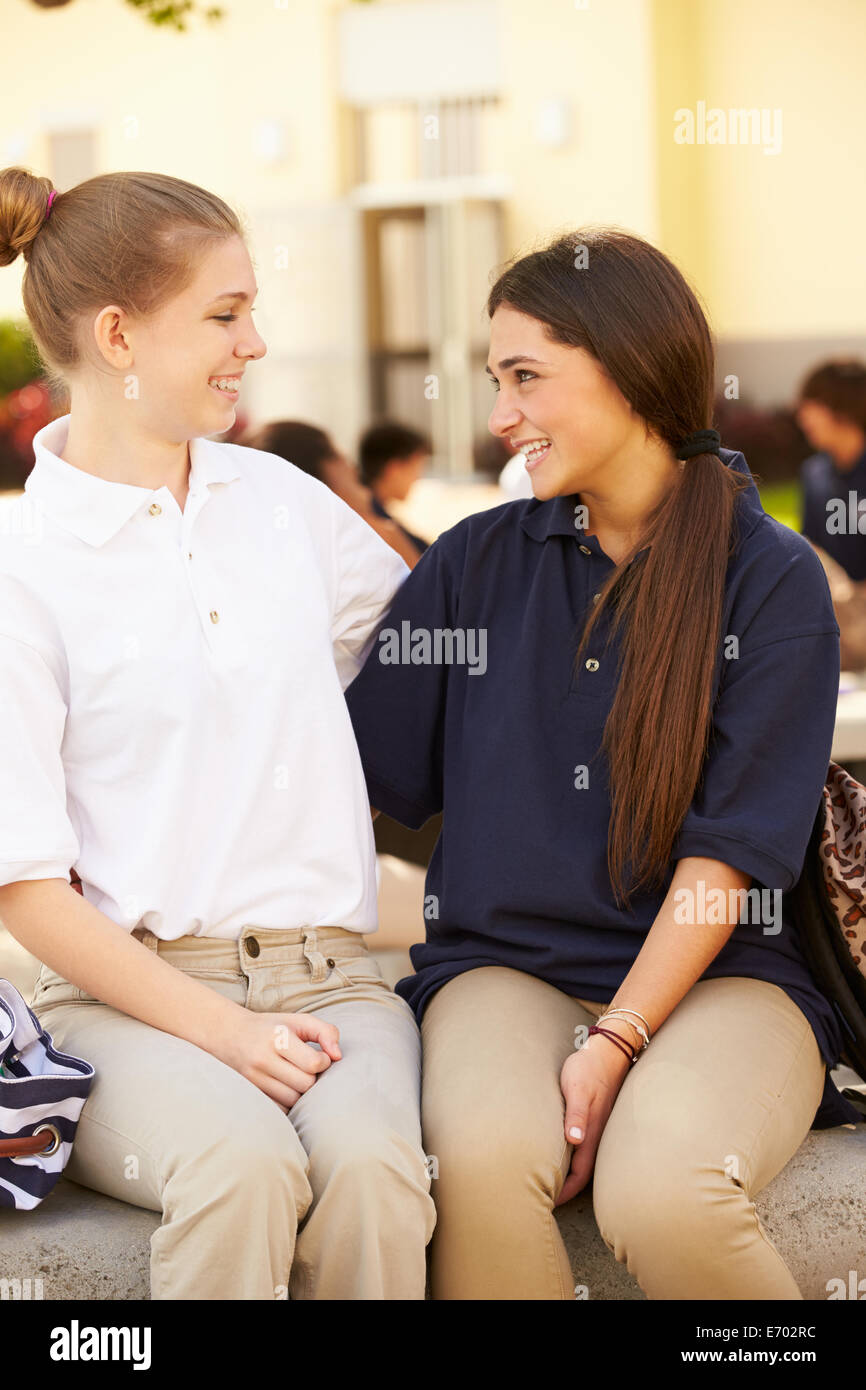 Two Female High School Students Wearing Uniform Stock Photo