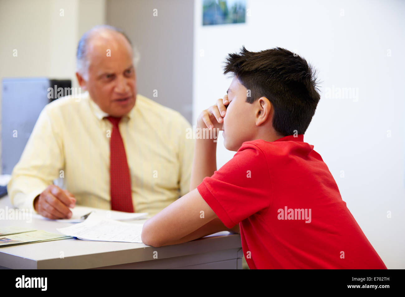 Male Student Talking To High School Counselor Stock Photo