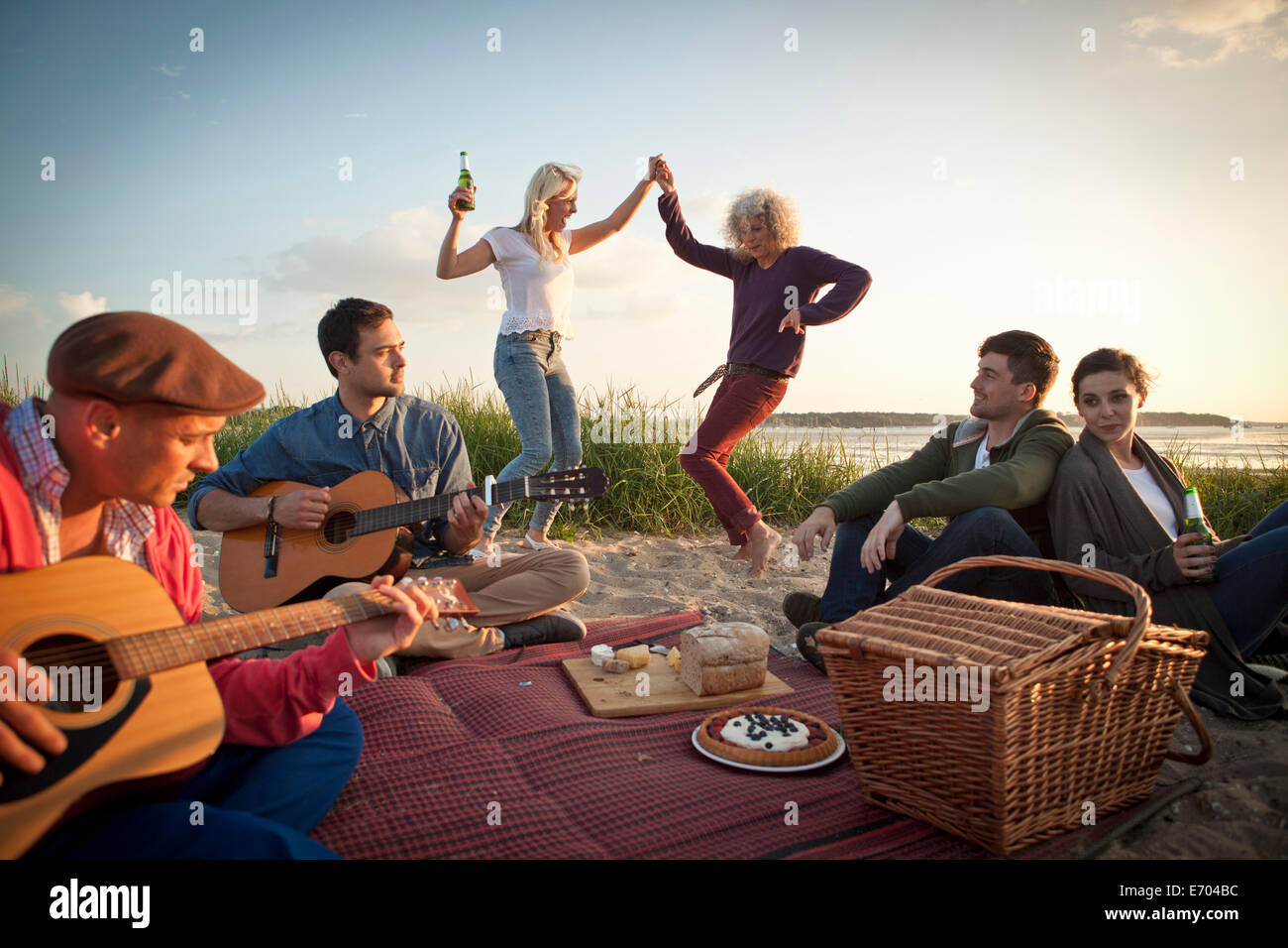 Woman dancing beach jeans hi-res stock photography and images - Alamy