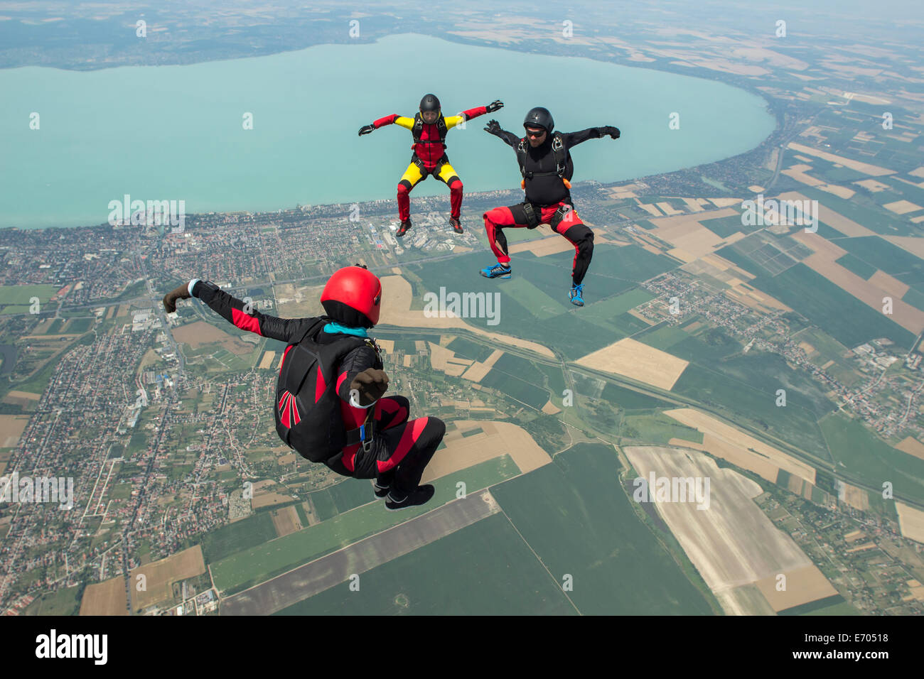 Three skydivers freeflying in formation, Siofok, Somogy, Hungary Stock Photo