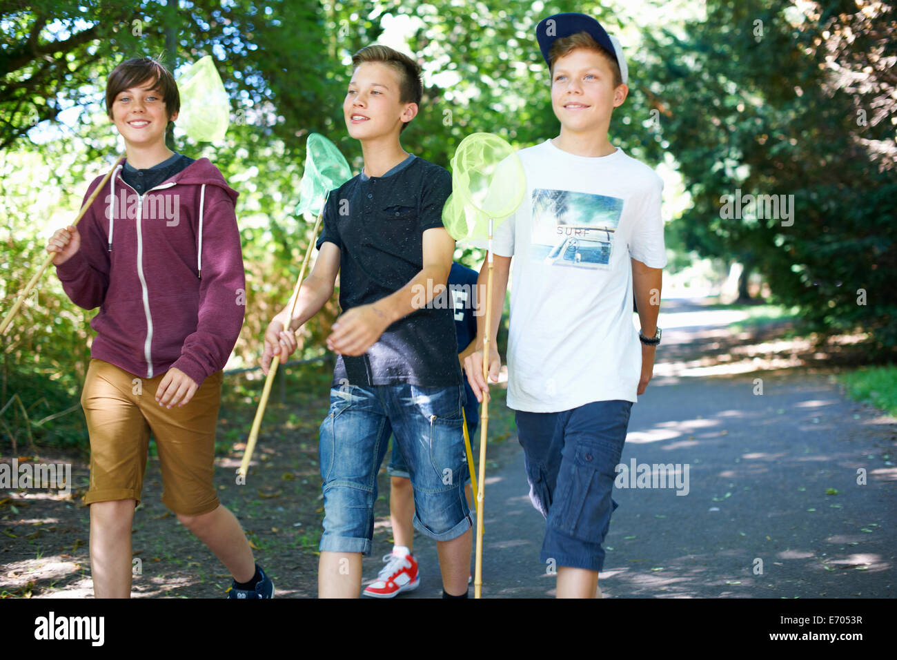 Three boys with fishing nets Stock Photo