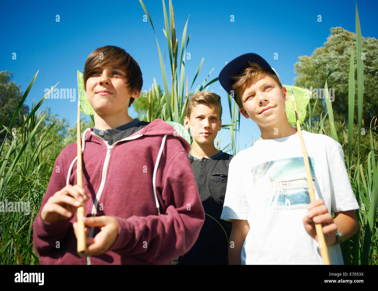 Boys holding fishing nets Stock Photo