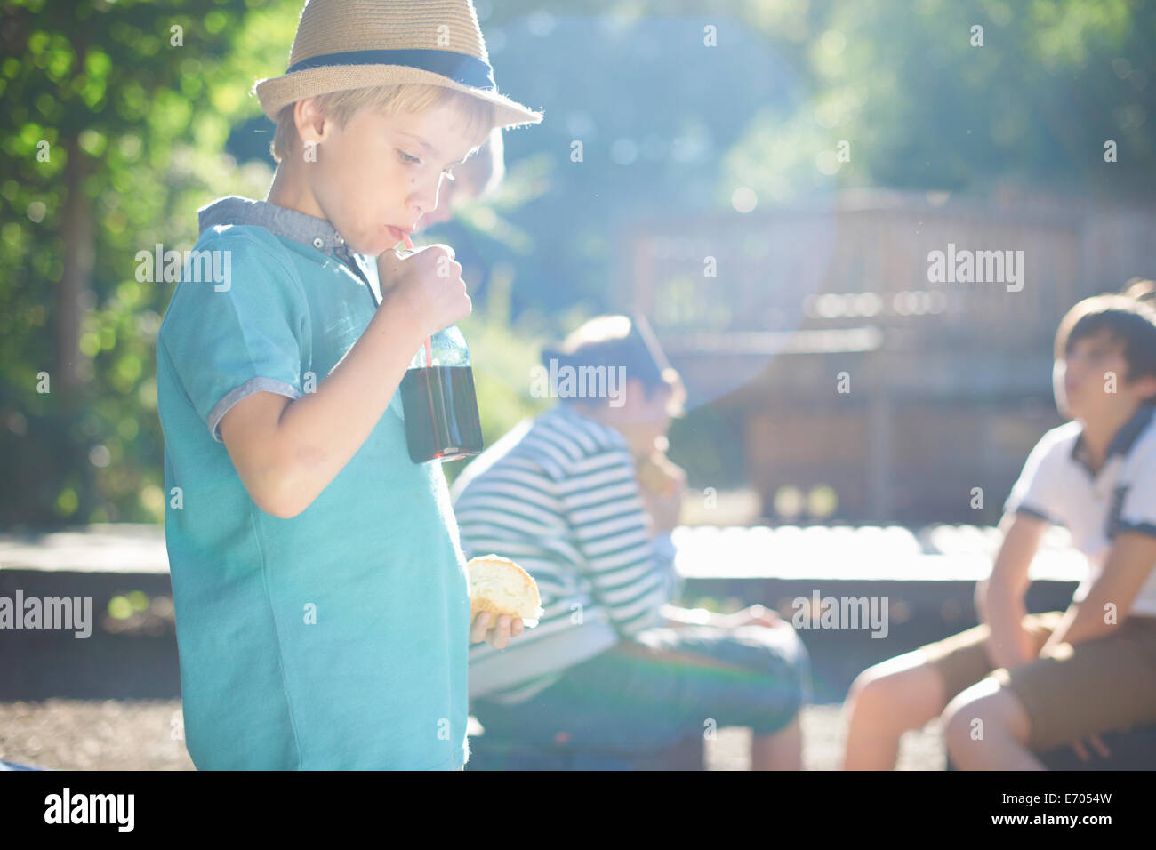 Young boy having lunch in park Stock Photo