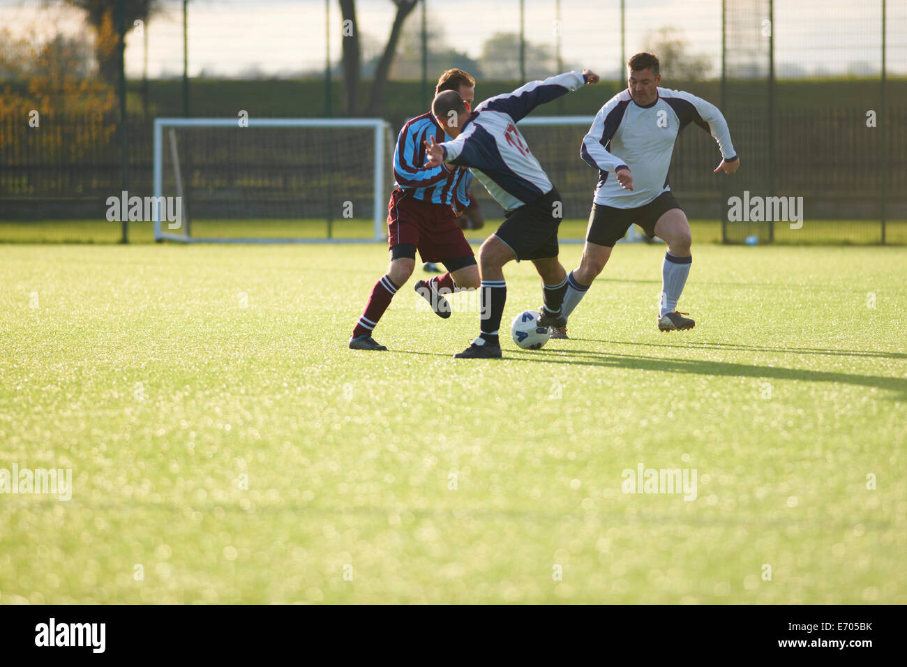 Football players fighting for ball Stock Photo