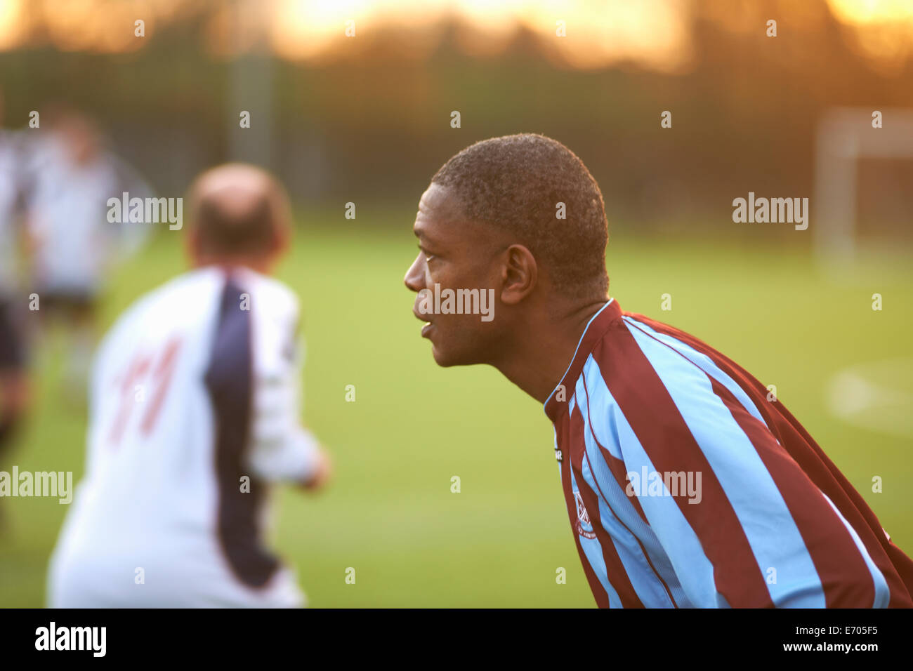 Football player alert at game Stock Photo - Alamy