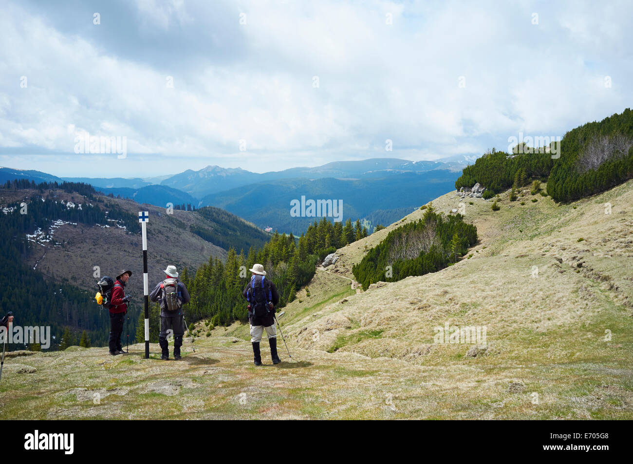 Three hikers, Bucegi Mountains, Transylvania, Romania Stock Photo