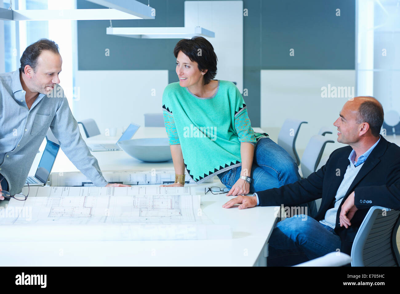 Three workers having business meeting Stock Photo