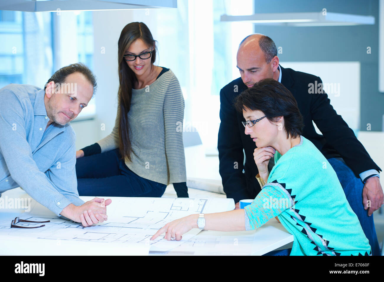 Group of business people looking at plans Stock Photo