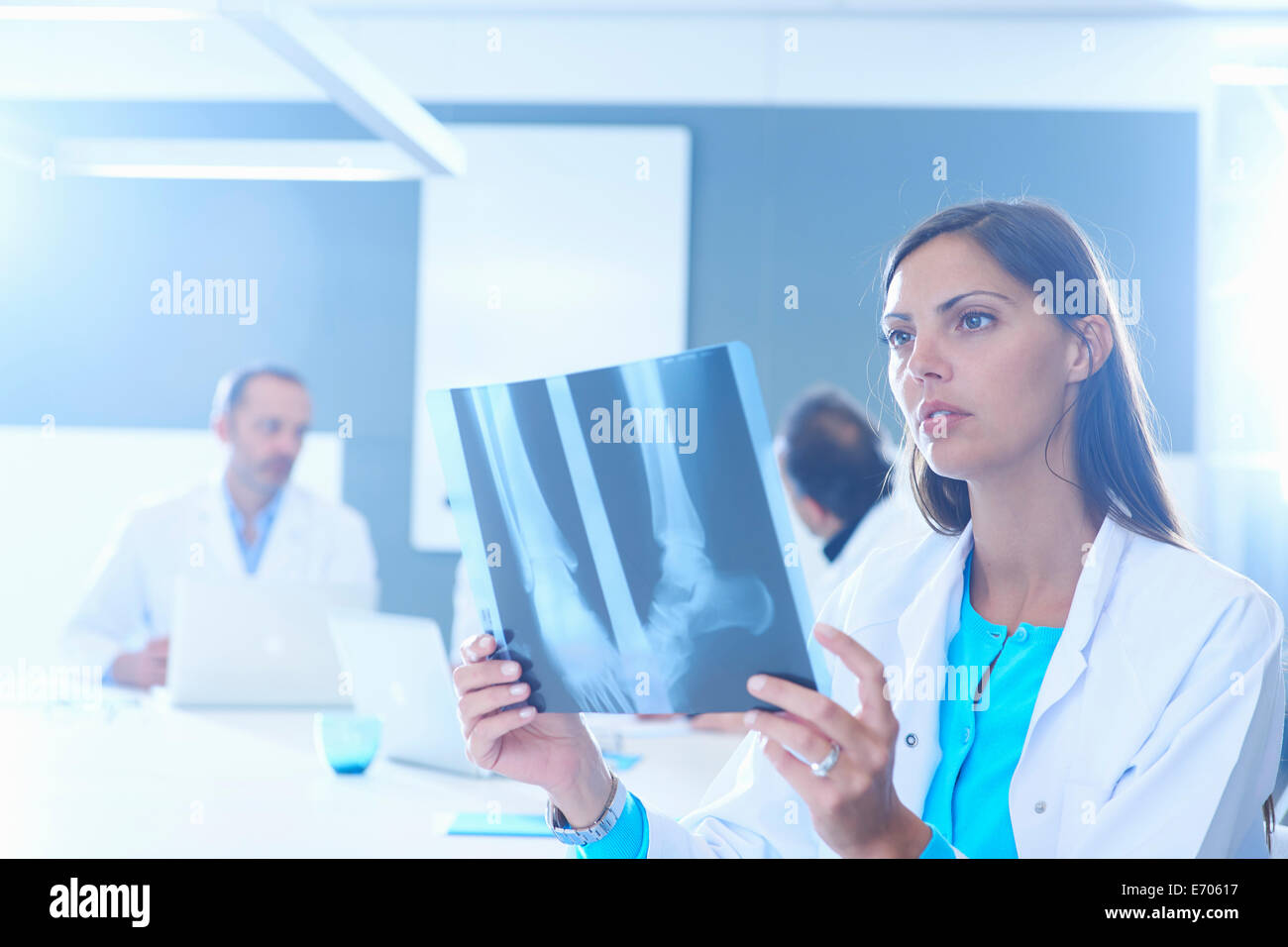 Female doctor looking at x-ray Stock Photo