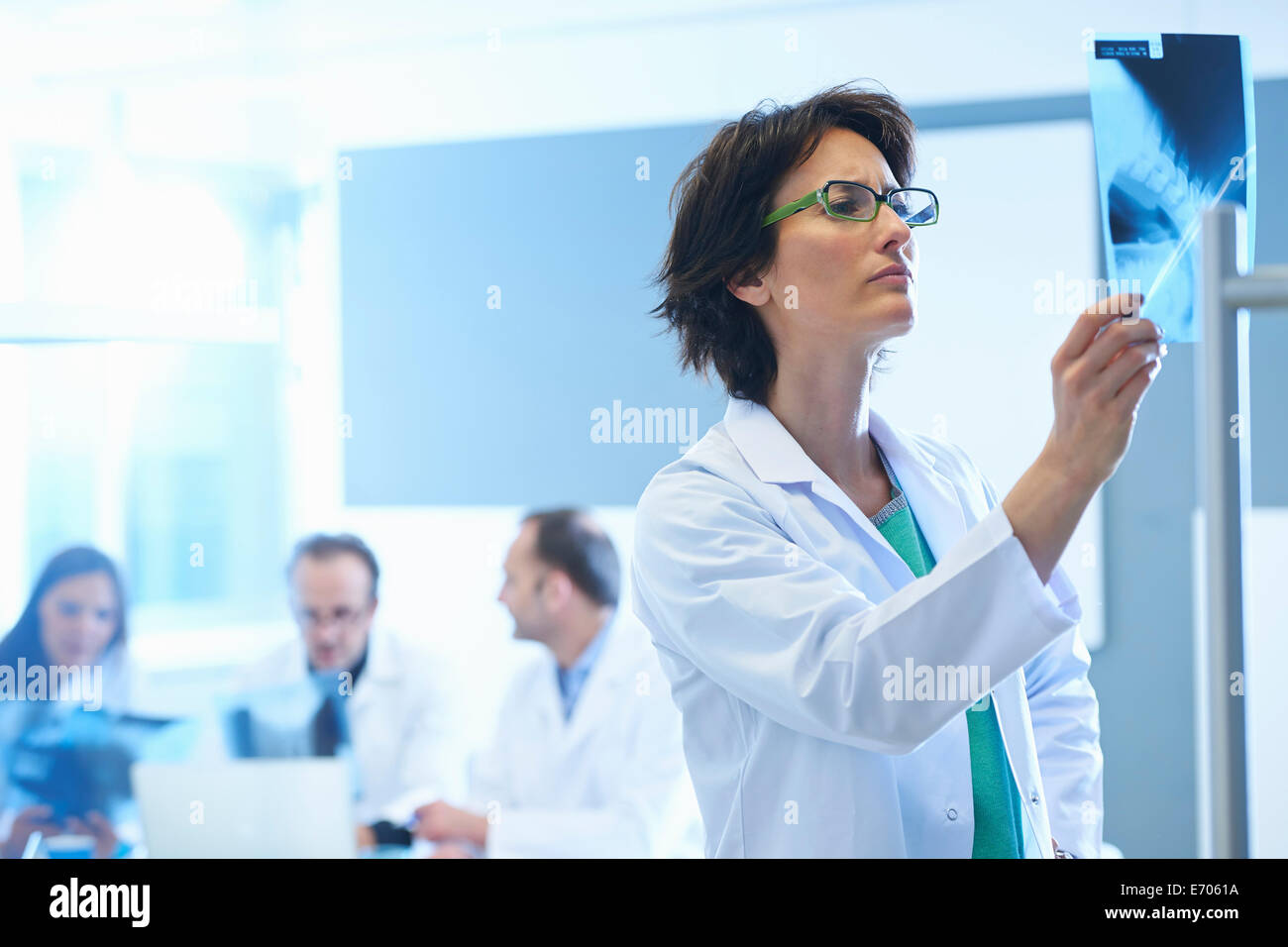 Female doctor looking at x-ray Stock Photo