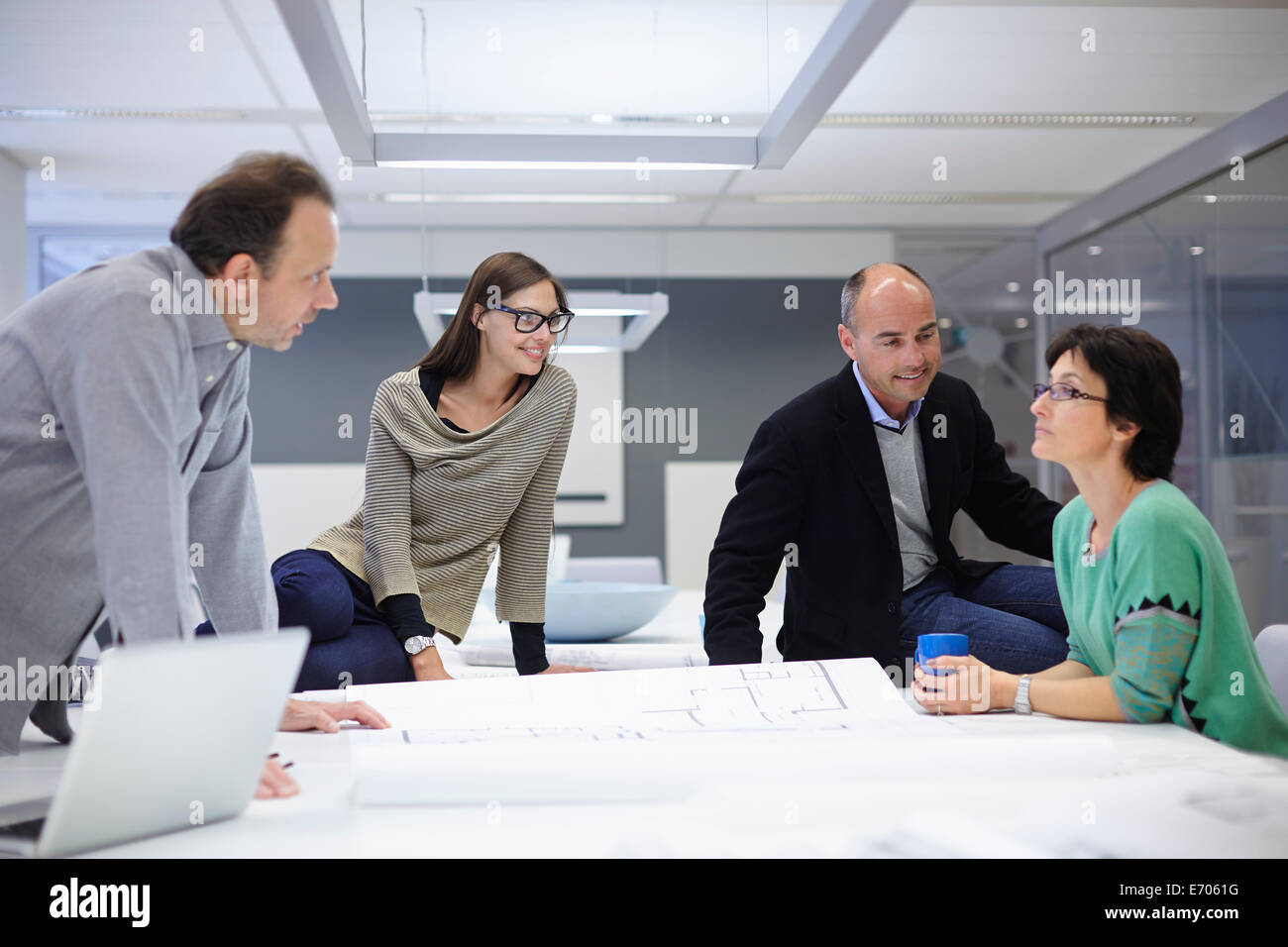 Group of business people looking at plans Stock Photo