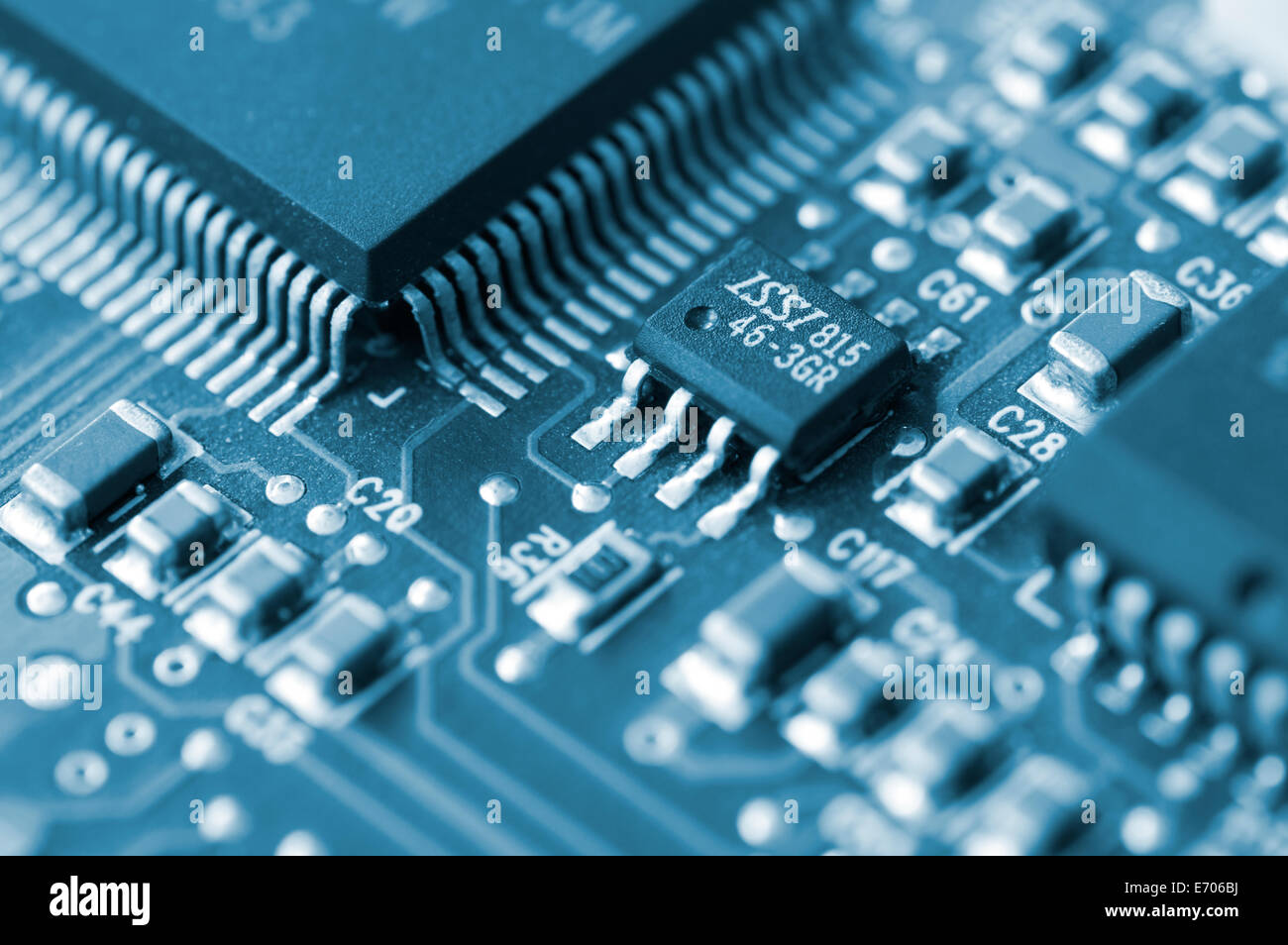 Closeup of a printed circuit board with components such as integrated circuits Stock Photo