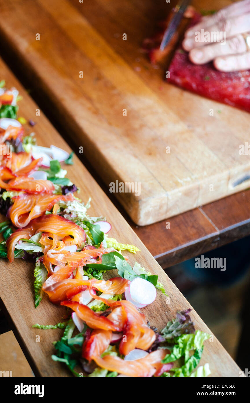 Gravlax salmon salad on wooden board Stock Photo Alamy
