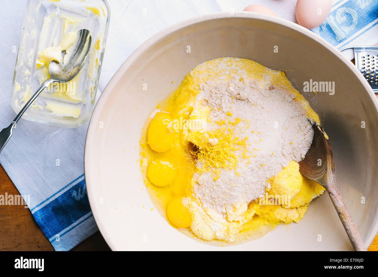 Eggs and flour in mixing bowl Stock Photo