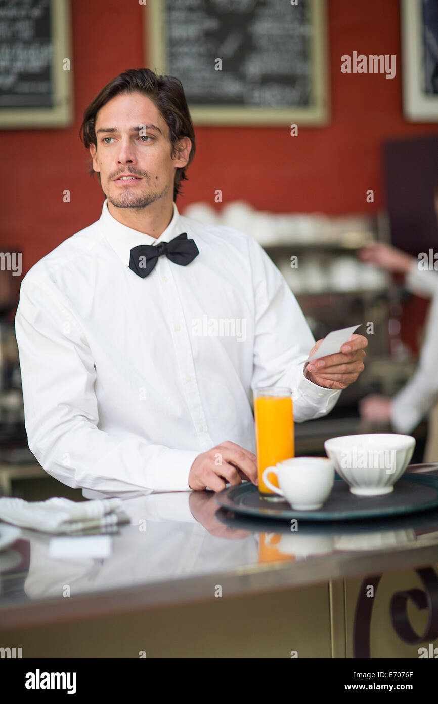 Waiter preparing drinks order at bar in restaurant Stock Photo Alamy