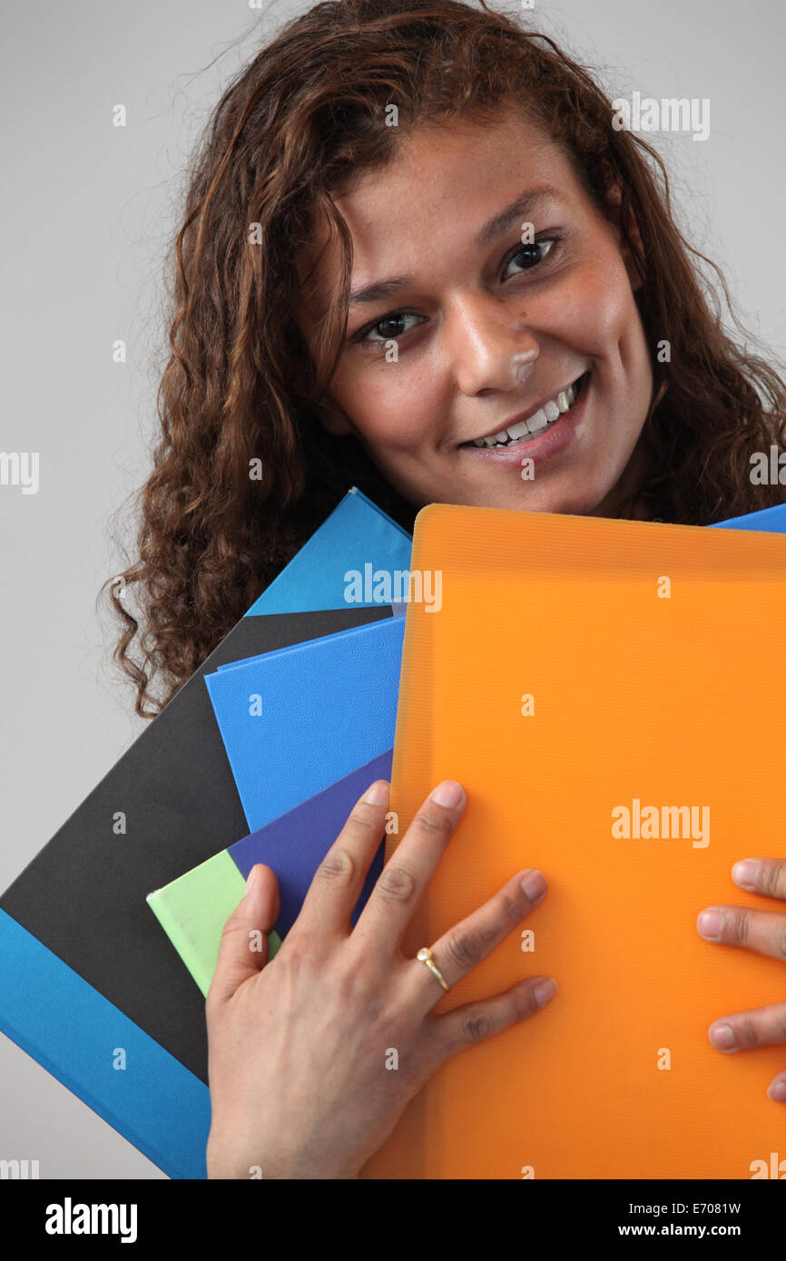 Administrative worker holding lots of folders Stock Photo - Alamy