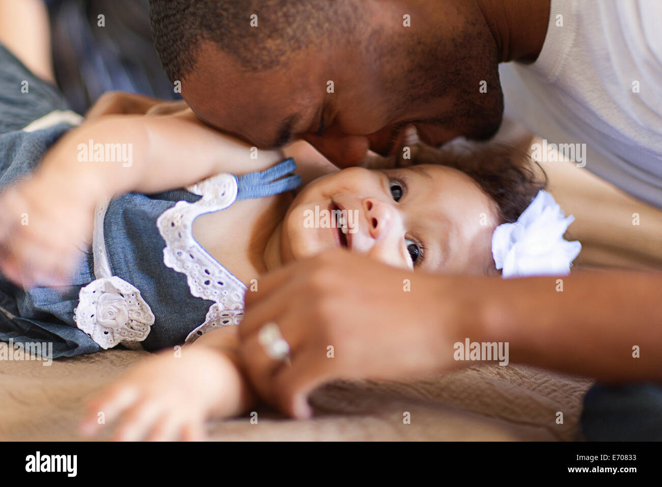Father playing with baby daughter Stock Photo
