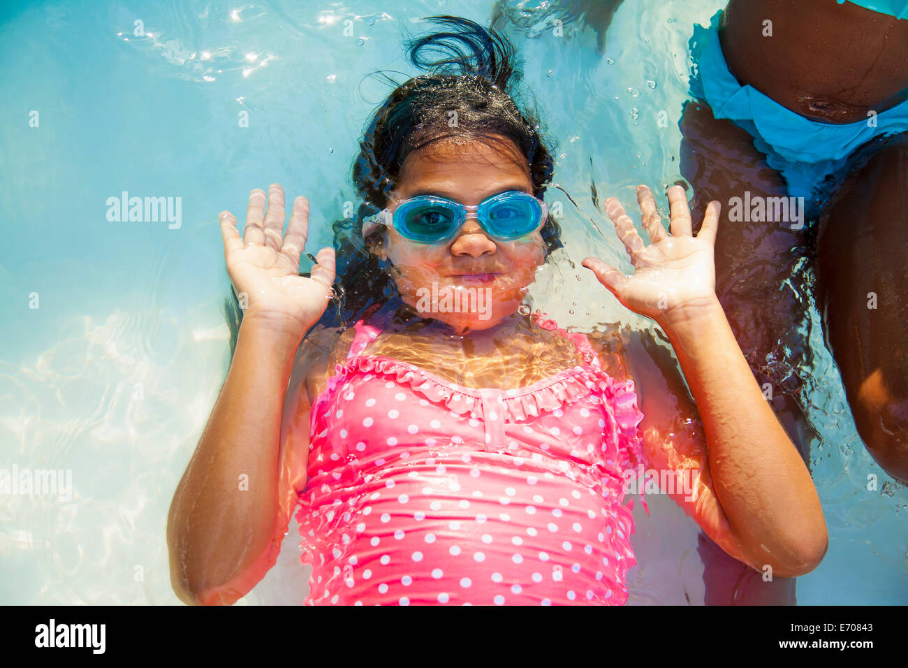 Girl in swimming goggles underwater in garden paddling pool Stock Photo -  Alamy