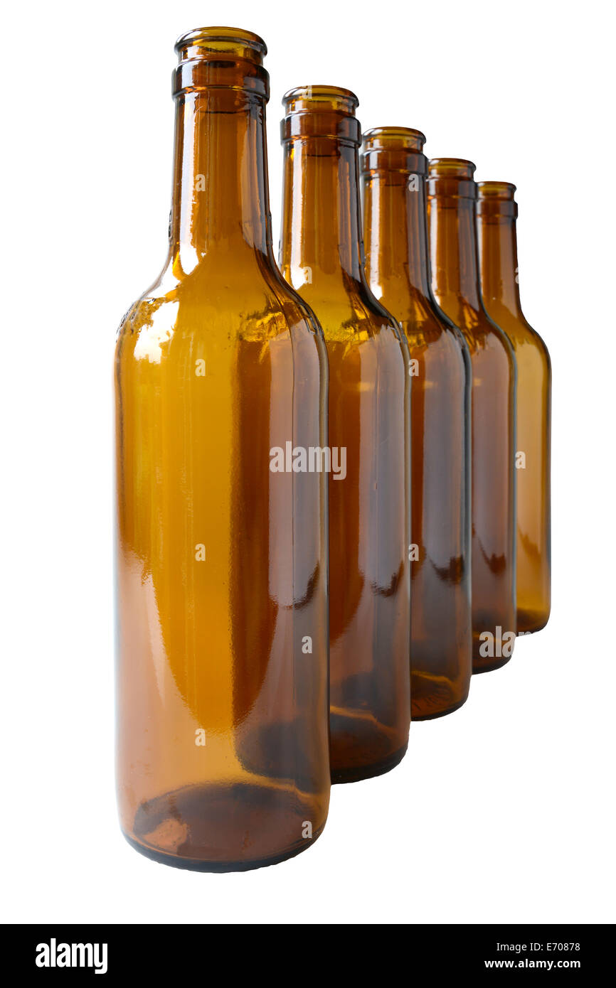 Five empty brown glass lager beer bottles on white background Stock Photo