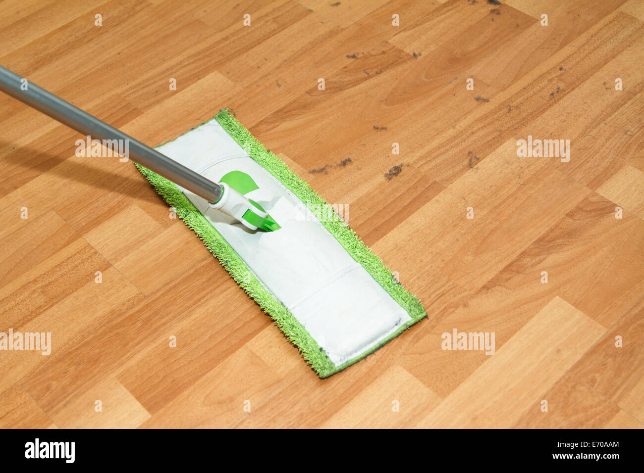 Mop Cleaning And Washing The Wooden Parquet Floor In Room Stock
