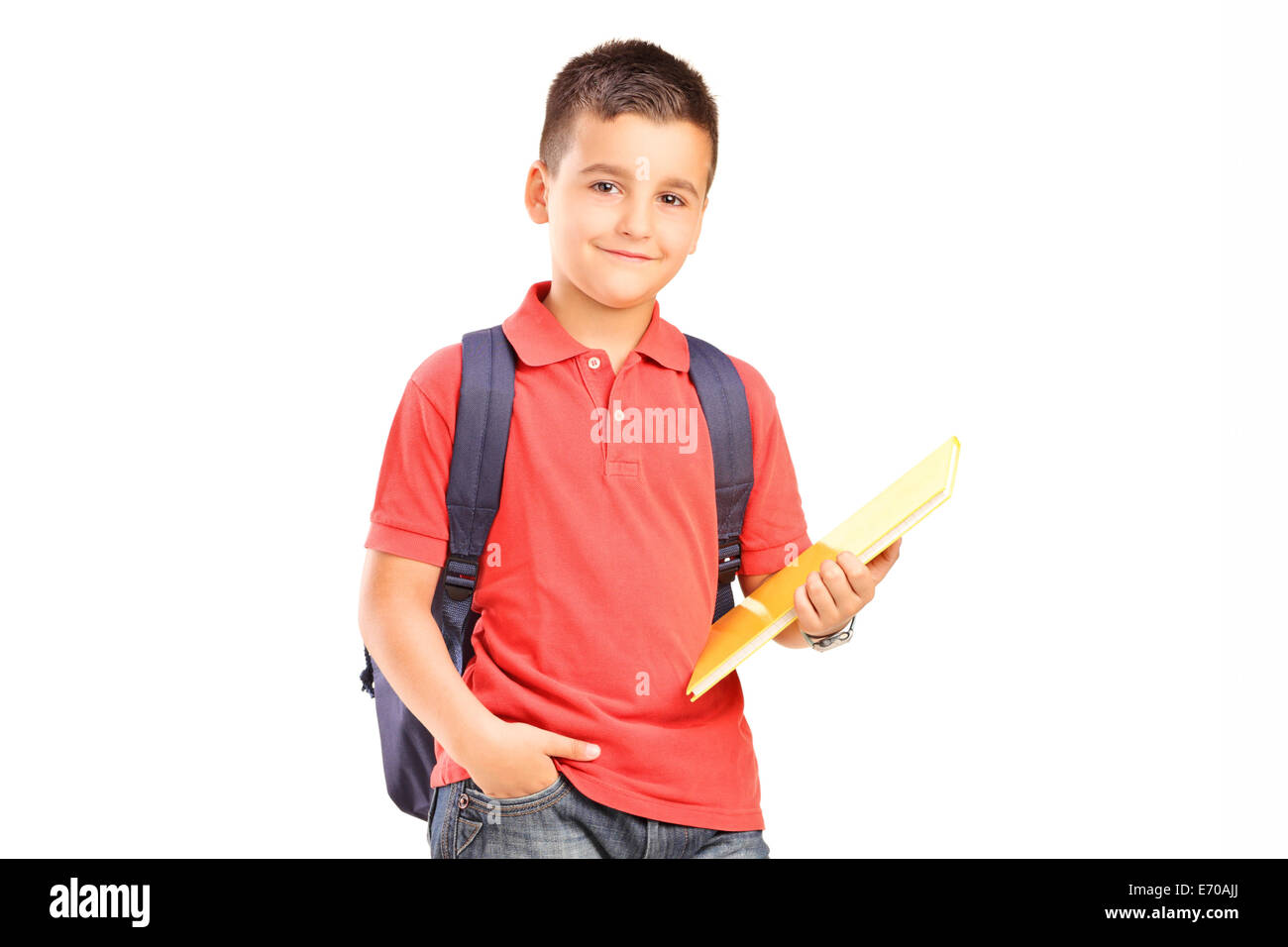 Schoolboy with backpack holding a notebook isolated on white background ...