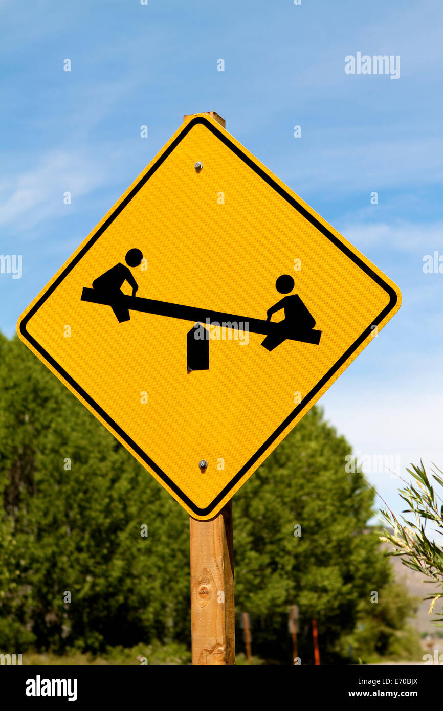 Seesaw teeter totter sign for a children's park or playground Stock Photo
