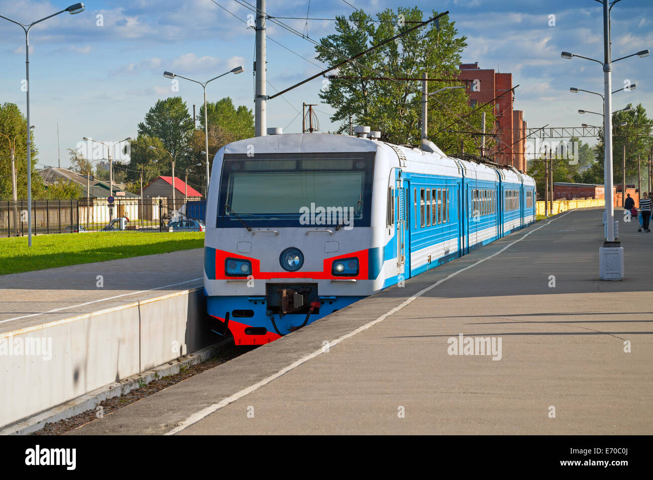 Modern suburban electric train standing at the station Stock Photo