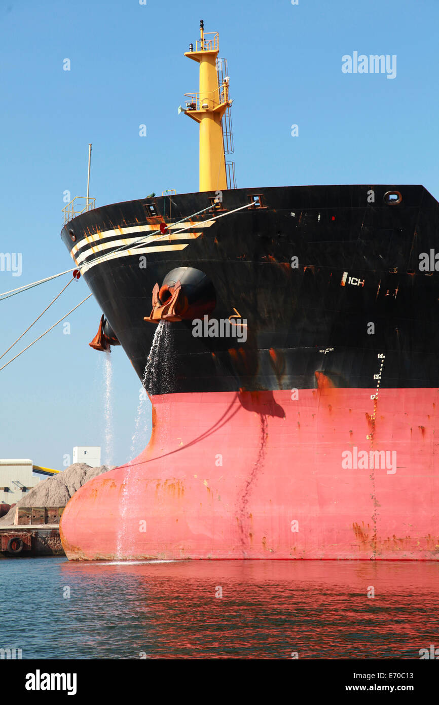 Bow of big red industrial cargo ship Stock Photo