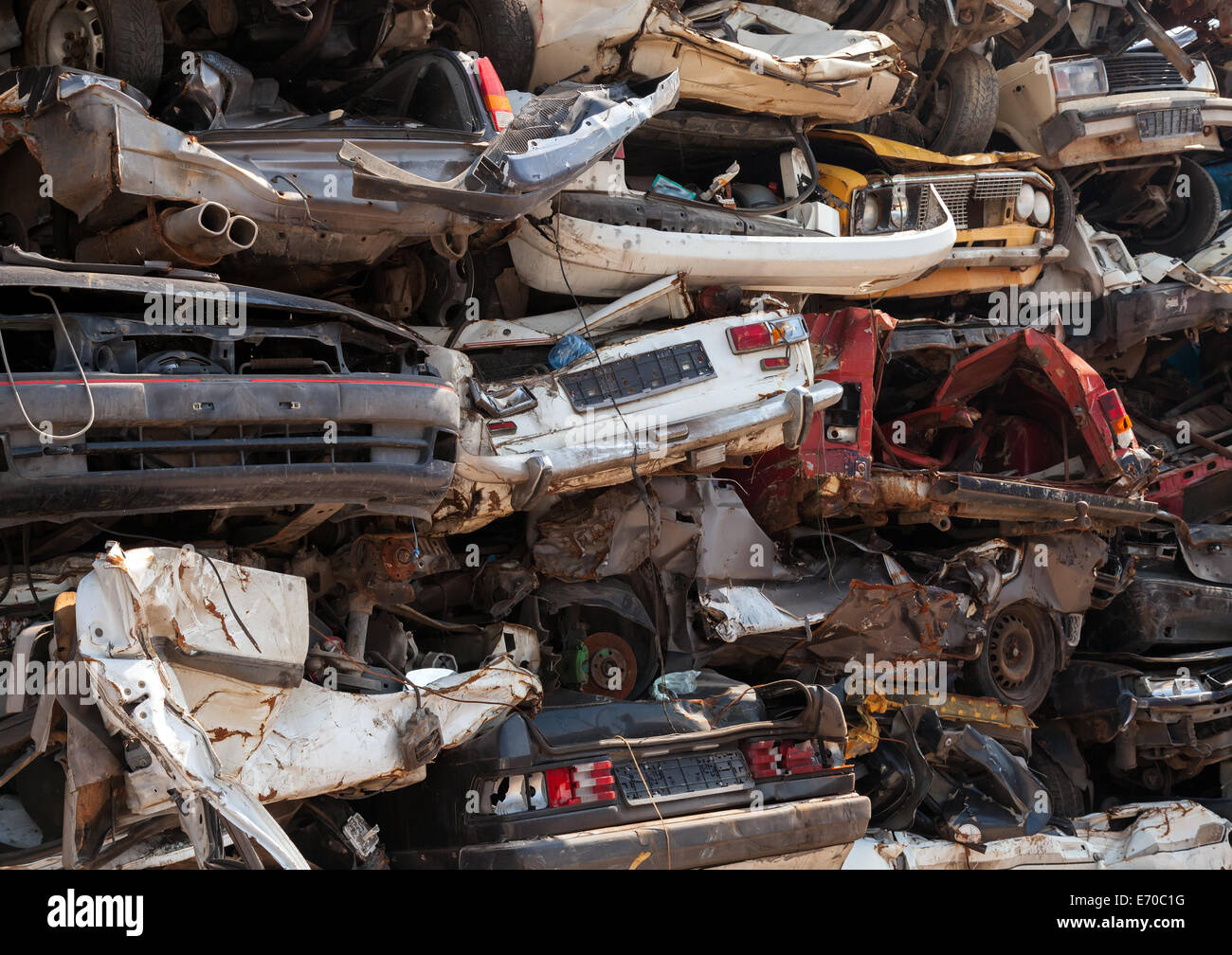 Abstract background, dump of stacked cars in junkyard Stock Photo