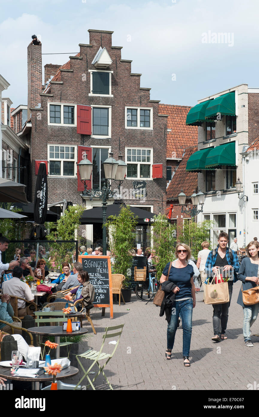 People siting in a street cafe and , medieval city centre, Amersfoort, Netherlands Stock Photo