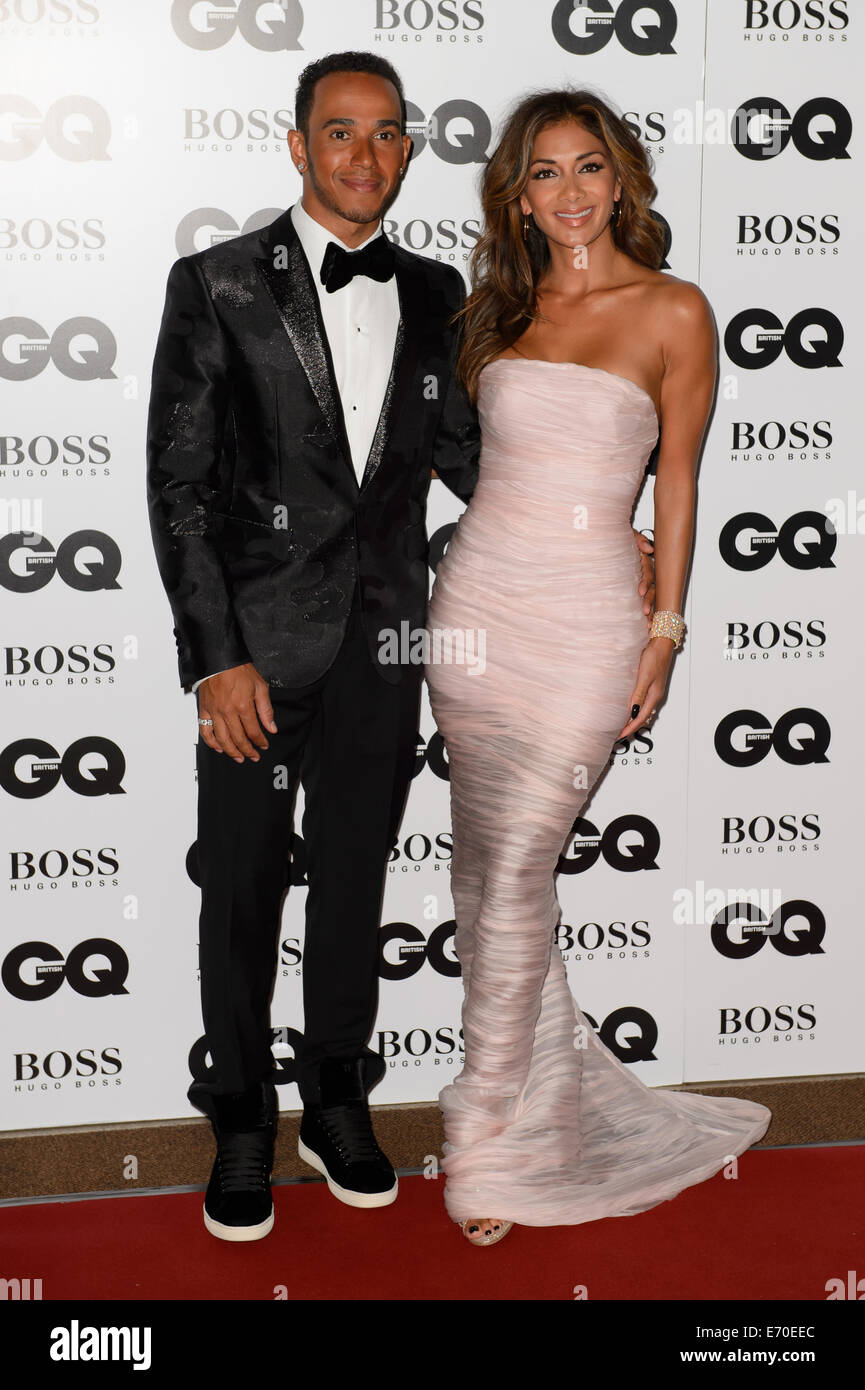 Lewis Hamilton and Nicole Scherzinger arrive for the GQ Men Of The Year Awards 2014. Stock Photo