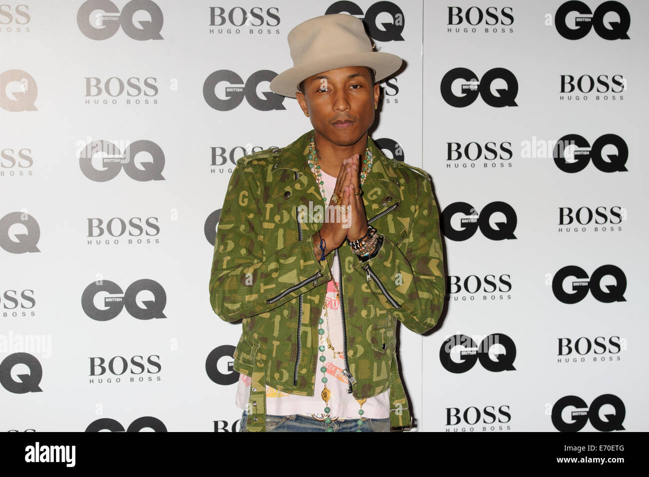 Pharrell Williams arrives for the GQ Men Of The Year Awards 2014. Stock Photo